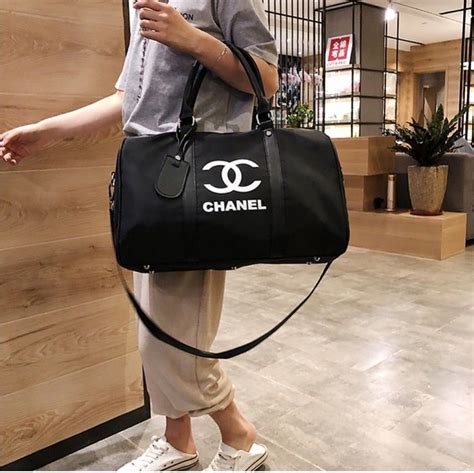 chanel mini duffle bag|Chanel travel bag with wheels.